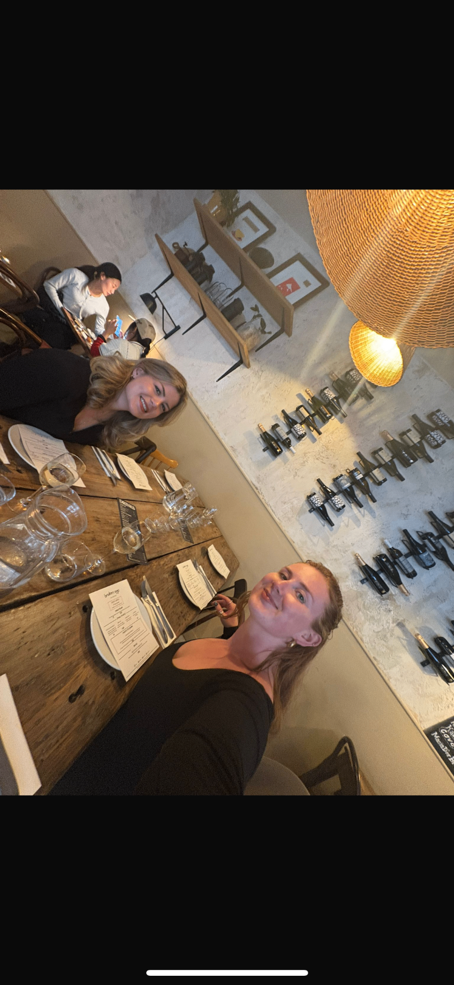 Members gathered around a candlelit supper club table